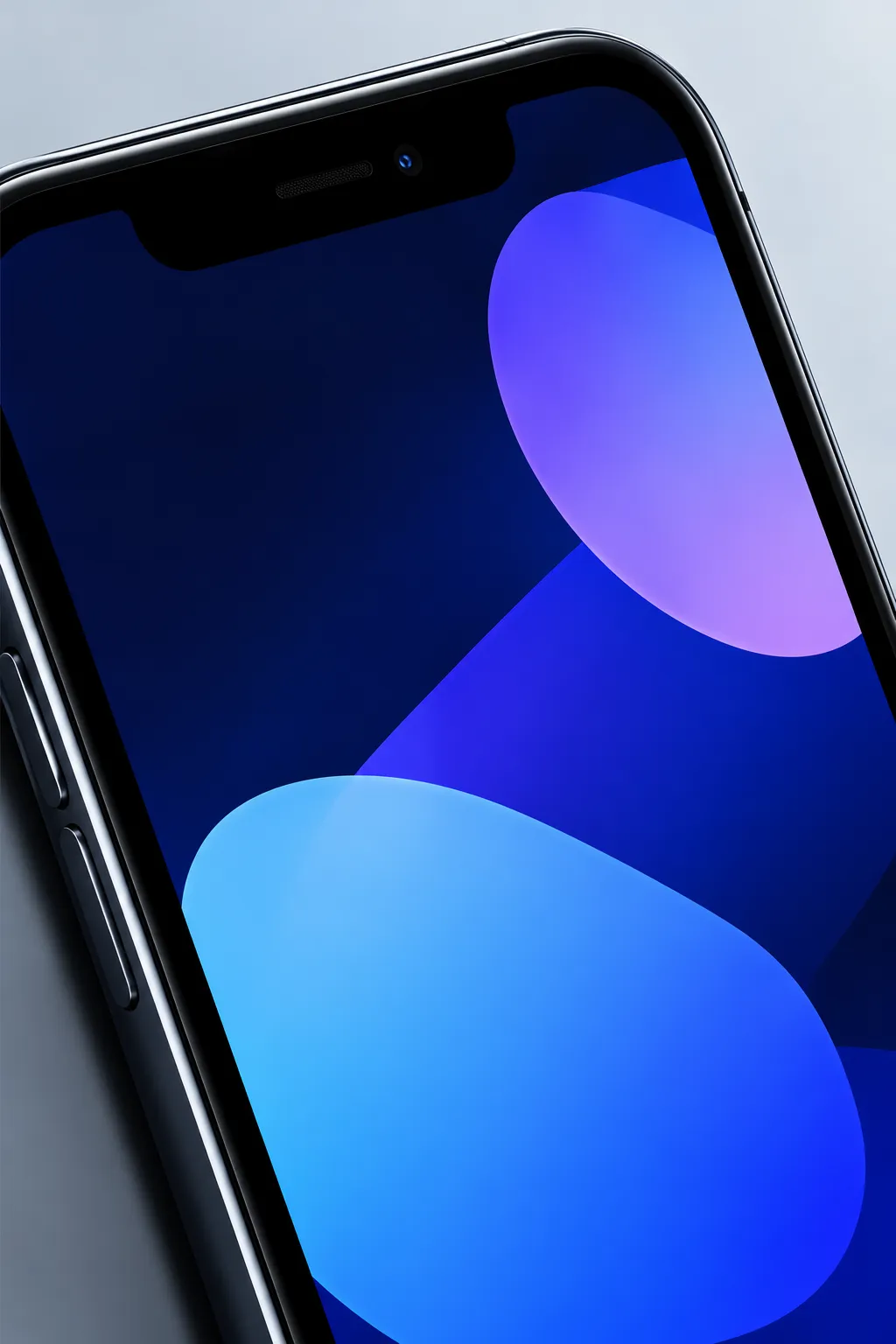 The corner of a phone whose screen glows with soft blue and violet shapes