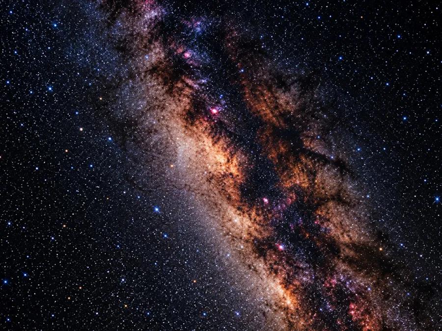 A diagonal band of the Milky Way, dense with stars and dust
