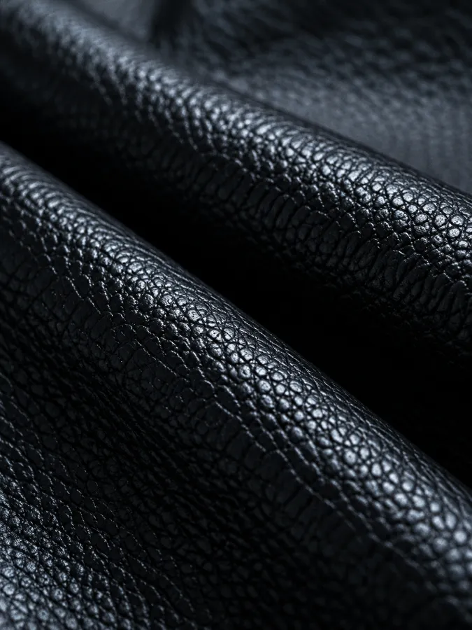 A close-up of black pebbled leather